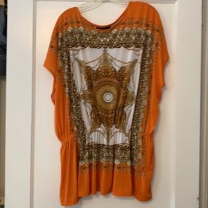 Isabella Rodriguez orange/tan top